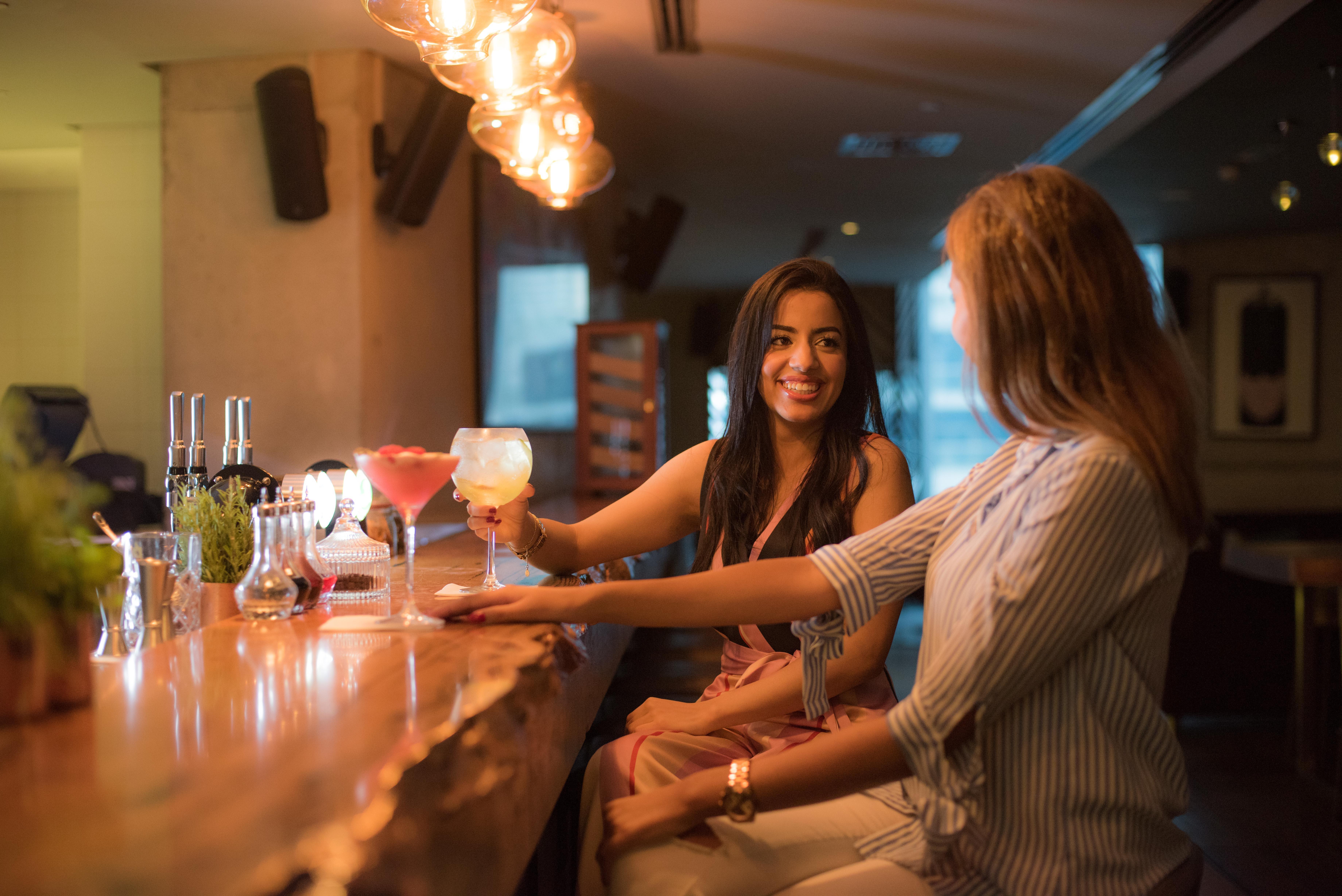 Intercontinental Dubai Marina By Ihg Hotel Exterior photo Two women drinking cocktails